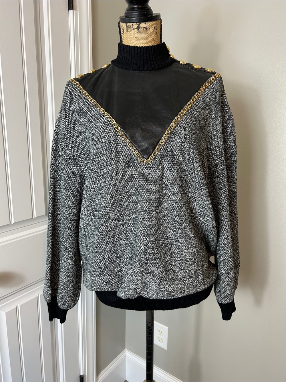 St. John -Black and gray Top with Gold accent and leather.